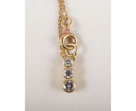 A diamond pendant on chain, diamonds (3), brilliant cut stones, graduating in size, collet set in yellow metal on a fine trac