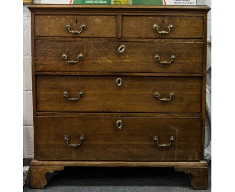 Georgian oak chest of drawers, moulded edge fitted with two short and three long drawers, bracket feet, width 94cms.
