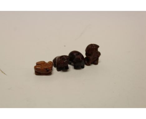 Four miniature wooden netsuke figures to include Monkey, Pig, Dog & Money Toad (?)