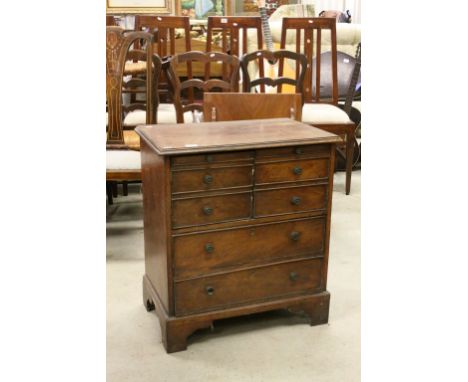 Georgian Mahogany Chest with Faux Drawers to top opening to reveal cupboard above two drawers below raised on bracket feet, 7
