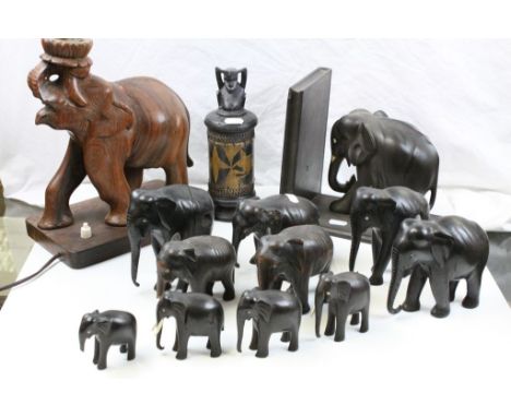 Carved wooden elephant lamp base and African fertility carving. plus herd of hand carved wooden elephants +elephant book rest