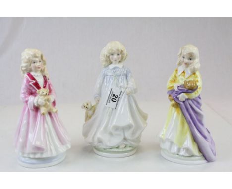 Three Royal Doulton NSPCC ceramic figurines with certificates, models Faith, Hope & Charity