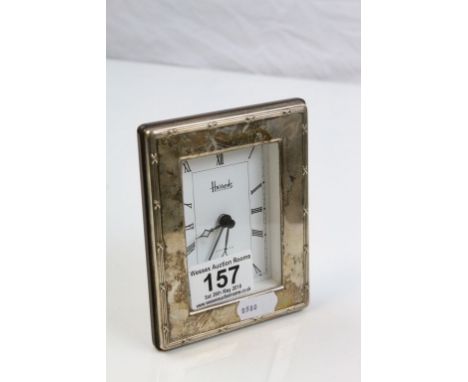 Harrods desk clock with silver frame, makers Harrods Ltd, London 1995, the silver frame with cross and reed border, white dia