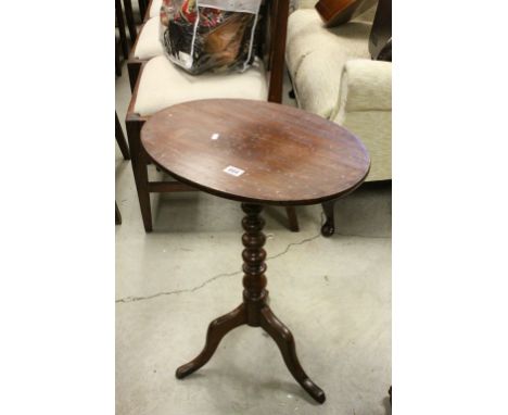 Georgian Mahogany Tilt Top Table with Oval Top and raised on turned bobbin support and three legs