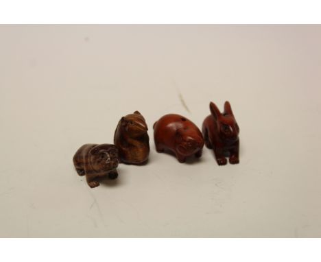 Four miniature wooden netsuke figures to include Rabbit, Pig, Dog & Mouse