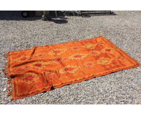 Vintage rug in red and orange 