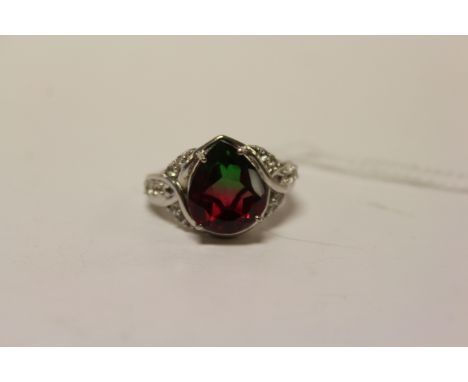 A silver CZ and pear shaped watermelon tourmaline style ring.
