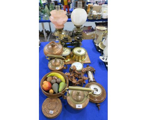 A collection of copper and brass items including kettles, Schatz clock and barometer, scales, two oil lamps etc Condition Rep