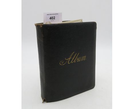 An early-20th century scrap/photograph album, containing pasted-in postcards largely of Scottish views, portrait photography,