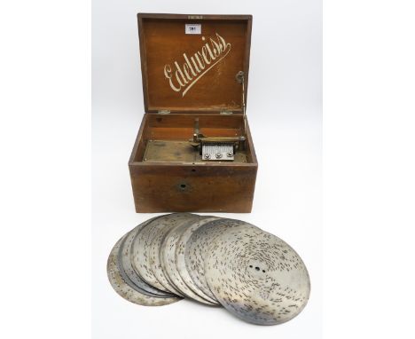 An Edelweiss hand-crank polyphon, with twelve various musical discs Condition Report:Available upon request