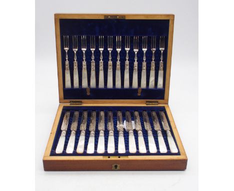 A cased canteen of EPNS and mother of pearl fish knives and forks, the knives and collars with engraved scrolling foliate dec