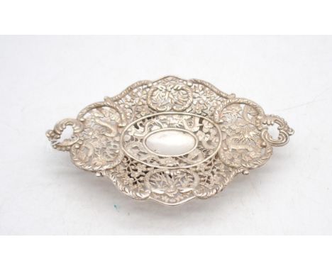A Chinese export silver footed dish, by Wang Hing, the body with pierced floral openwork, the centre decorated with dragons, 