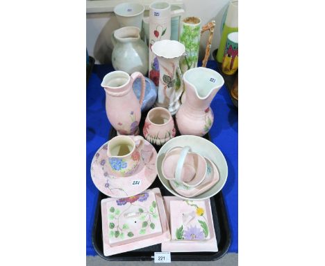 A collection of E Radford pottery with painted decoration of flowers Condition Report:No condition report available.