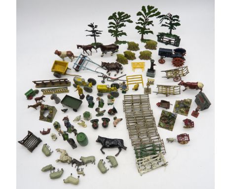 A collection of lead farmyard animals, vehicles and accessories, contained in a vintage vellum suitcase; together with a smal