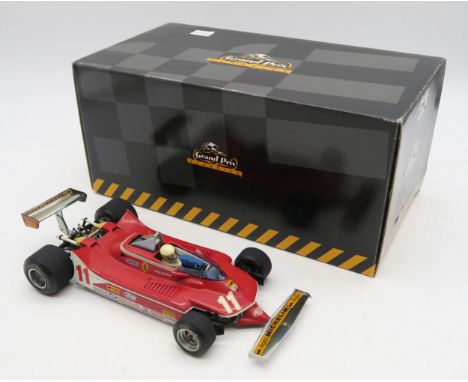 An Exoto Grand Prix Classics 1:18-scale Ferrari 312T4/T5 and a Minichamps 1:18-scale McLaren Ford M23 Yardley P. Revson 1973,