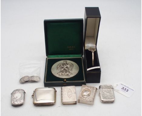 A collection of silver including a Victorian silver vesta, by John Thompson &amp; Sons, with embossed scrolling foliate decor