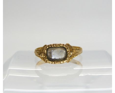 A 22ct gold Victorian mourning ring with plaited hair under glazed panel, Hallmarked London 1848, finger size Q1/2, weight 2.