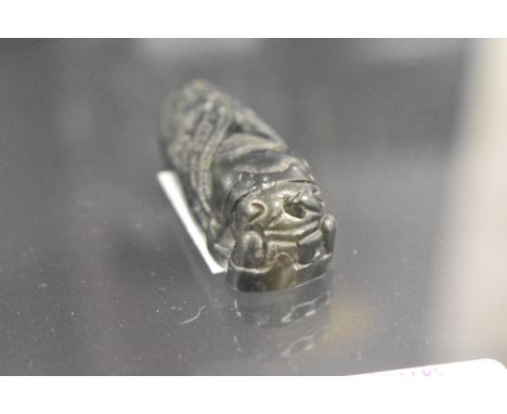 A Chinese spinach jade pendant carved in the form of a Cicada insect