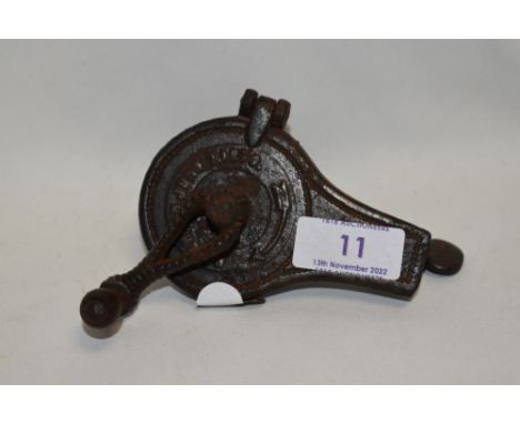 A Victorian cooks spice or similar grinder dated 1870 with cast metal case