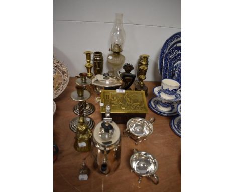 A selection of vintage metal ware, to include tea pots, candlesticks, bells, and more, also included is an oil lamp.