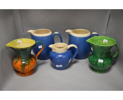 Five Art Deco design ceramic water jugs in various colours and glazes