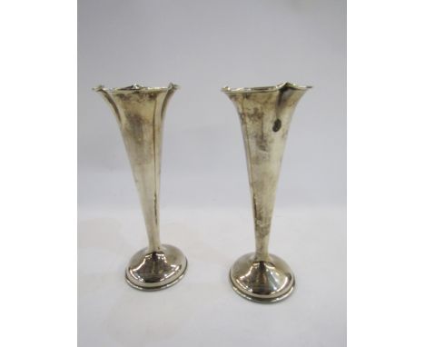 Pair of silver vases, Birmingham 1981, maker's mark rubbed, of fluted trumpet form, weighted, 17.5cm high, gross weight 10.7o