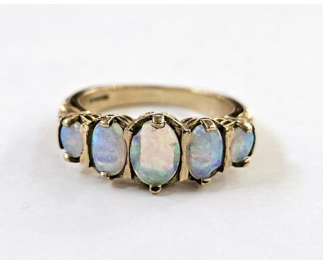 9ct gold and opal ring set five oval stones (one chip), finger size N1/2&nbsp;