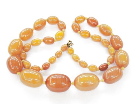 Graduated amber bead necklace, approx. 71cm long, the largest central bead approx. 3.25cm long&nbsp;Condition ReportThe neckl