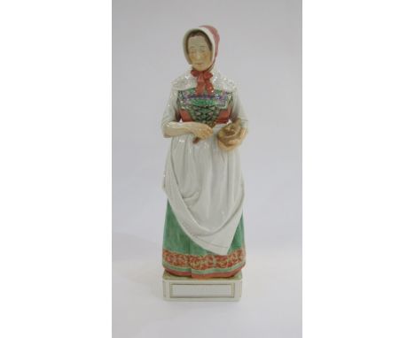 20th century Royal Copenhagen porcelain figure&nbsp;designed by Carl Martin-Hansen (circa 1906-1925), 'Hedebo' a woman holdin