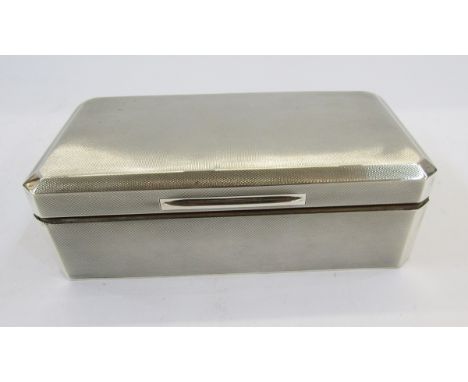 Silver-mounted cigarette box, rectangular with canted corners, engine-turned, Birmingham 1937, 18cm wide