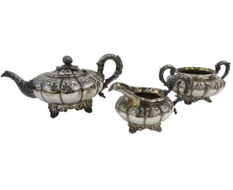 George IV silver three-piece teaset with teapot, two handled sugar basin and cream jug, each piece oblate and panelled with f