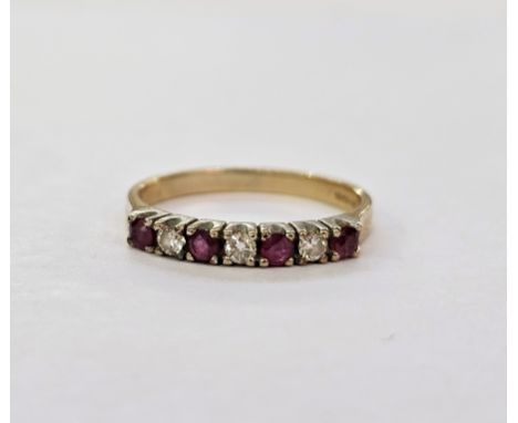 9ct gold seven-stone diamond and ruby ring&nbsp;with alternating brilliant cut diamonds and circular mix cut rubies in claw s