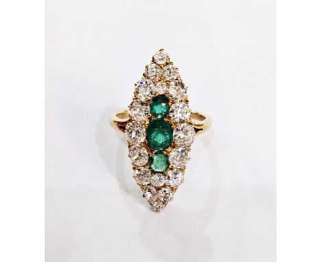 Gold-coloured metal, emerald and diamond dress ring, marquise-shaped with three rounded rectangular central emeralds surround