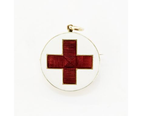 Gold-coloured enamel brooch pendant of WW1 interest, the circular form enamelled with a red cross on a white ground, the reve