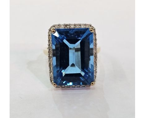 9ct gold, bluestone and small diamond dress ring set large turquoise coloured rectangular gemstone surrounded by small diamon