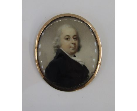 Georgian portrait miniature&nbsp;of a gentleman in a black coat and ivory cravat, oval on ivory, in gold-coloured mount, 7cm 