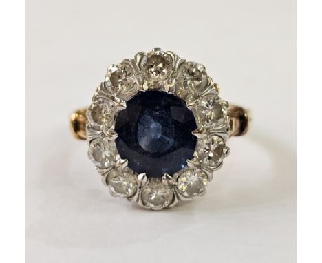 18ct gold and sapphire ring, the central oval sapphire surrounded by diamonds, weight 4gms, sapphire 8mm diameter, finger siz