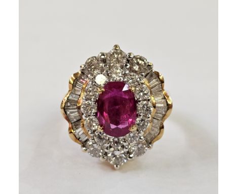 18ct gold, ruby and diamond dress ring, the oval ruby surrounded by inner border of circular diamonds, outer border of circul