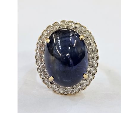 18ct gold dress ring, sapphire and diamond set large central oval cabochon sapphire surrounded by two rows of diamonds, possi