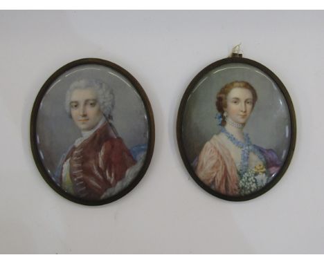 Pair of portrait miniatures&nbsp;depicting a lady and gentleman in the 18th century-style, he in a red jacket and she with fl