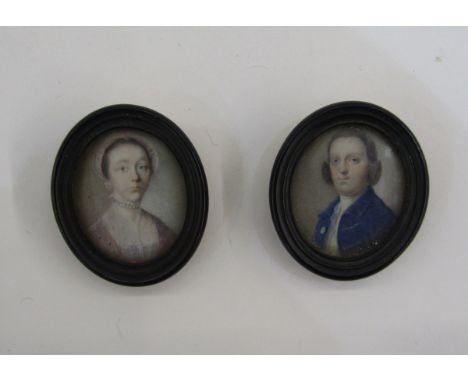 Pair of 18th century portrait miniatures&nbsp;depicting a lady in a pink dress wearing pearls and a gentleman in a blue coat,