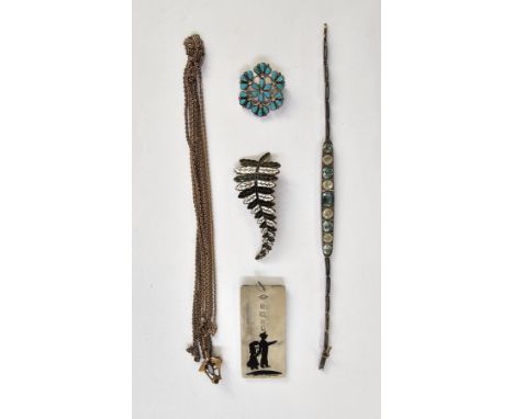 Silver ingot pendant&nbsp;with enamel decoration of two figures, a gilt metal and enamel spray brooch&nbsp;with registration 