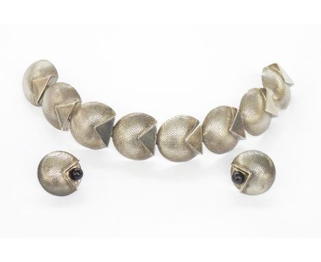 Silver bracelet and earrings set, maker UH, London 1990, the bracelet formed of textured circular links with polished triangu