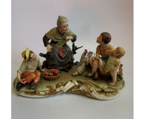 A large Capodimonte bisque porcelain figure group, One Upon a Time (C'era Una Volta), signed by the artist, 43cm wide. Condit