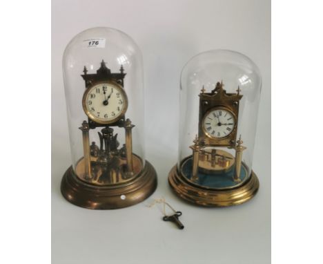 A vintage gilt brass German rotating ball anniversary torsion clock, together with another of similar design. Condition Repor