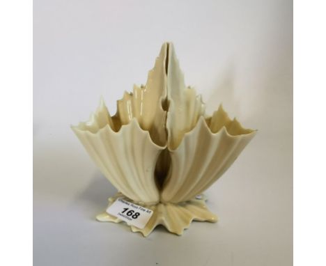 A cream three sectioned Royal Worcester porcelain vase of leaf like form.