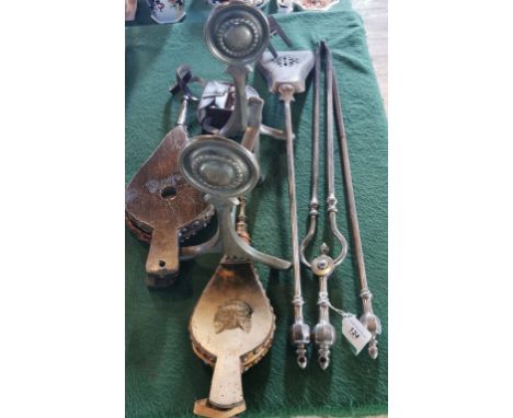 A Georgian companion set, a pair of fire dogs, two wooden bellows (one decorated with a cat) and a leather cased Nauticalia r