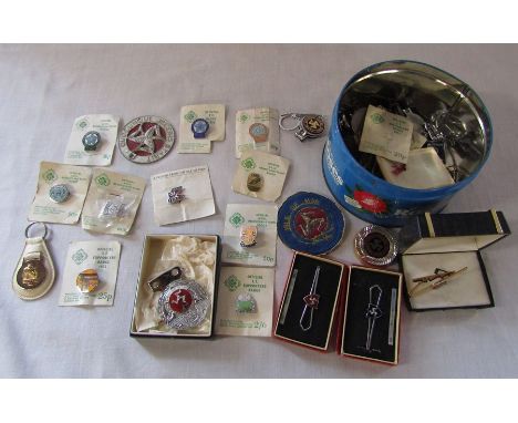 Selection of vintage Isle of Man TT pin badges, tie clips etc