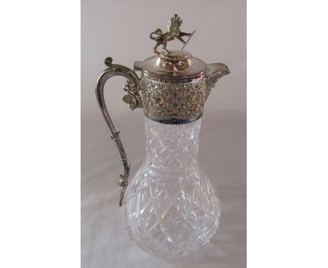 Cut glass and silver plate claret jug with mask head spout and lion and shield finial