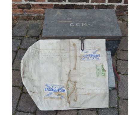 Small military trunk with blankets and a duffel bag with shipping labels along with a brief biography &amp; service history o